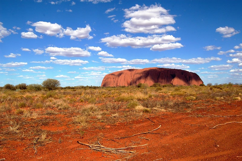 The iconic Uluru rock formation at sunset in the Australian Outback